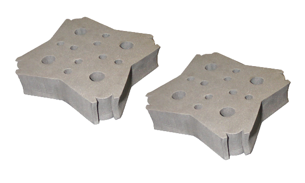 Two gray metal blocks with circular holes on a white background