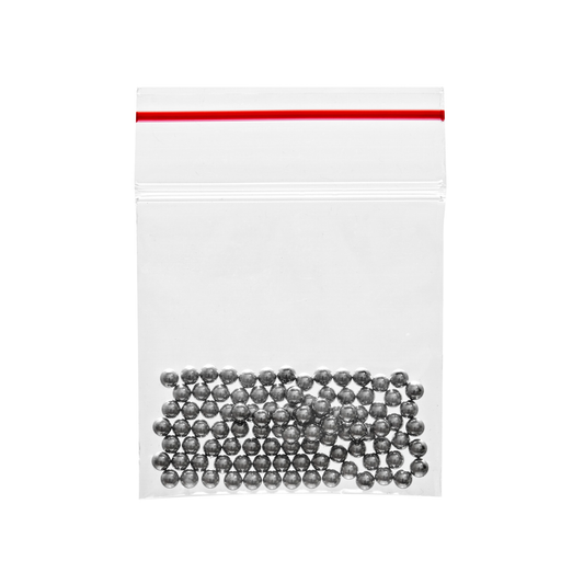 Clear plastic bag with red zipper containing small gray beads on a white background